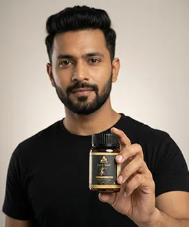 man holding Arebianveda shilajit capsule one of the best ayurvedic product